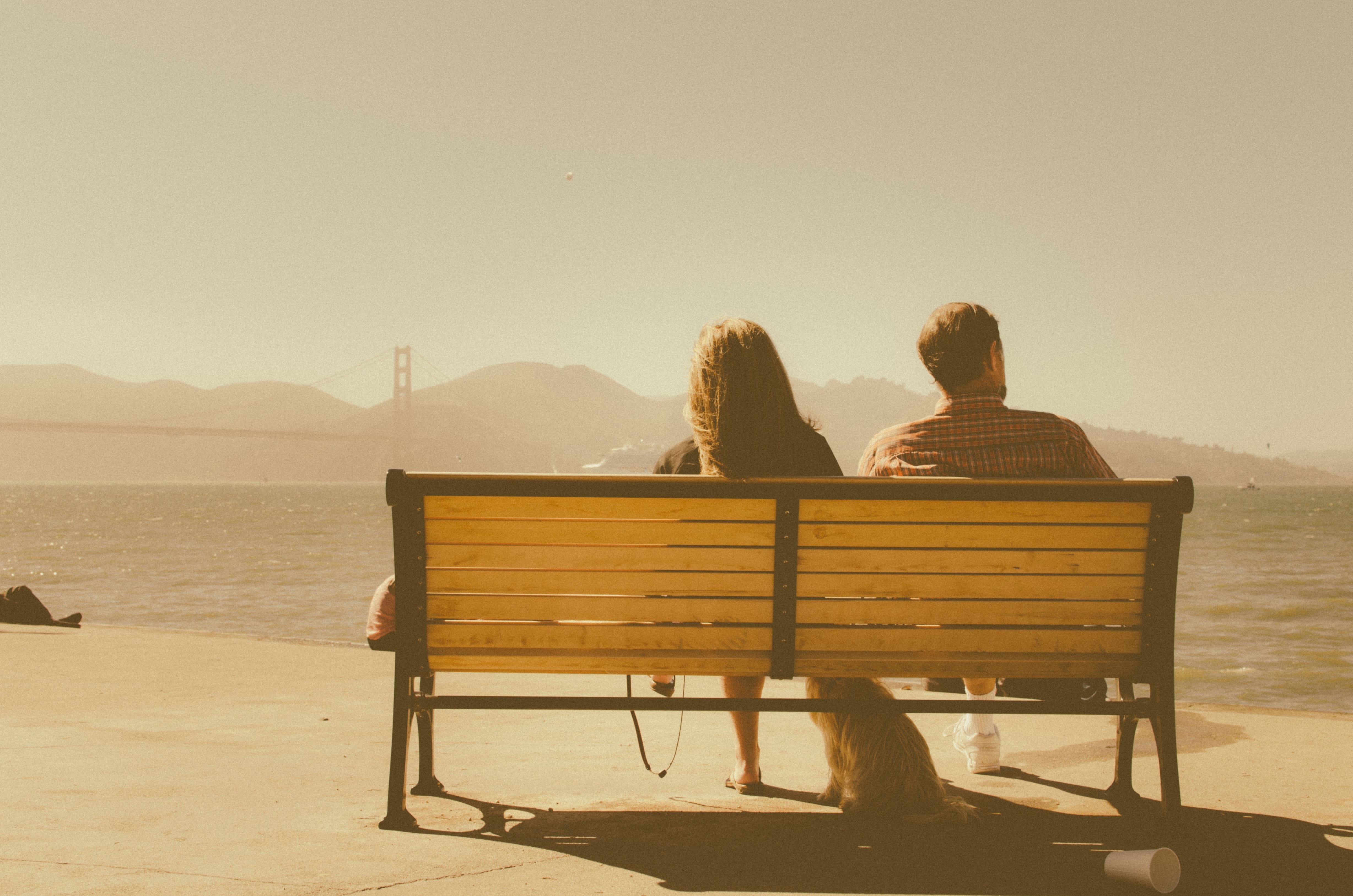 Man and woman looking at Golden Gate Bridge